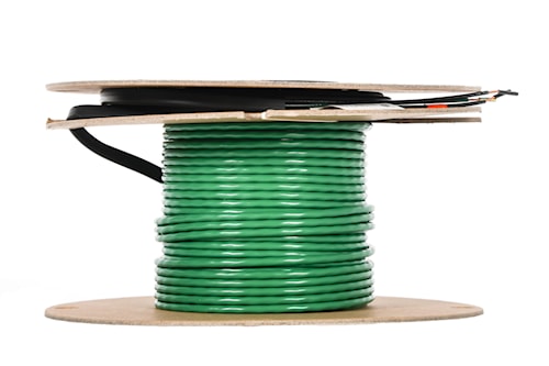 Bobine de câble électrique vert enroulé pour installation résidentielle ou commerciale, prête pour raccordements et travaux d’électricité.